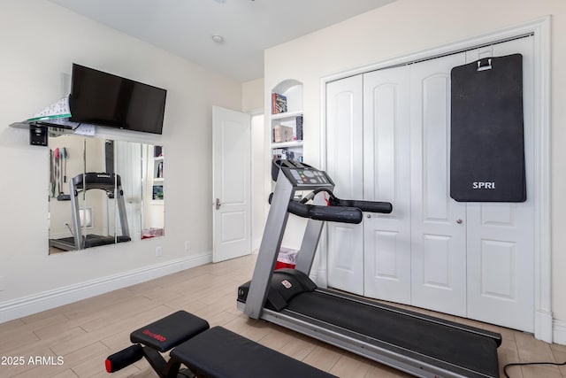 exercise area featuring light hardwood / wood-style floors