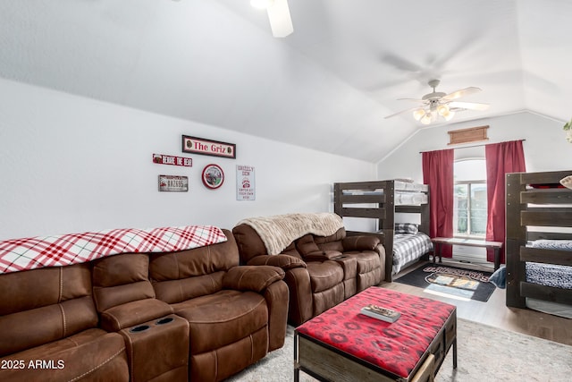 living room featuring vaulted ceiling, hardwood / wood-style floors, and ceiling fan