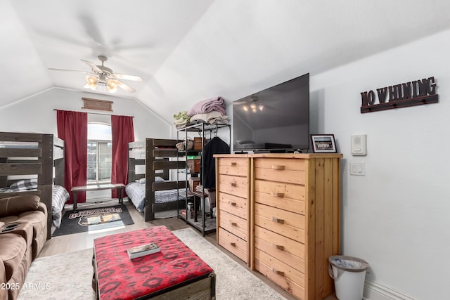 bedroom with lofted ceiling, hardwood / wood-style floors, and ceiling fan