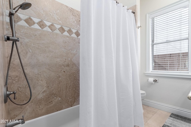 bathroom featuring tile patterned floors, shower / bath combination with curtain, and toilet