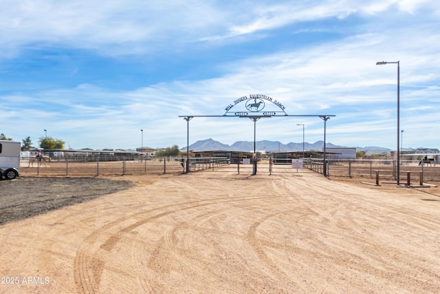 view of yard featuring a rural view and a mountain view