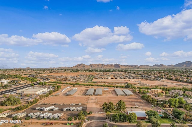 birds eye view of property featuring a mountain view