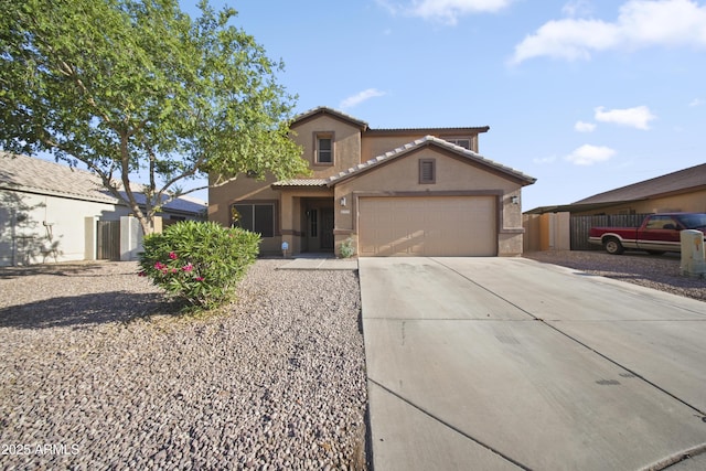 9719 W Heber Rd, Tolleson, AZ 85353 - view of front of property featuring driveway, a tile roof, fence, an attached garage, and stucco siding