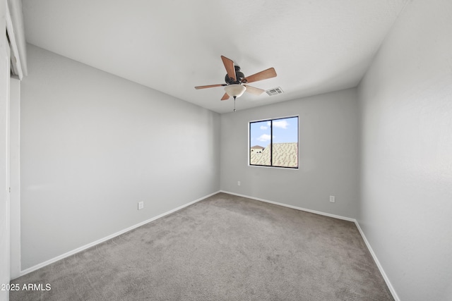 9719 W Heber Rd, Tolleson, AZ 85353 - unfurnished room featuring carpet floors, baseboards, a ceiling fan, and visible vents