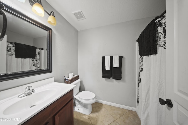 9719 W Heber Rd, Tolleson, AZ 85353 - full bathroom featuring vanity, toilet, tile patterned floors, baseboards, and visible vents