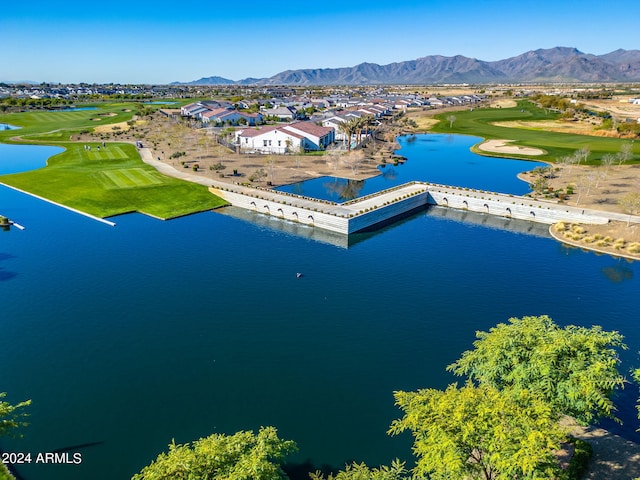 drone / aerial view featuring a residential view and a water and mountain view