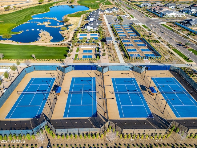 bird's eye view with view of golf course and a water view