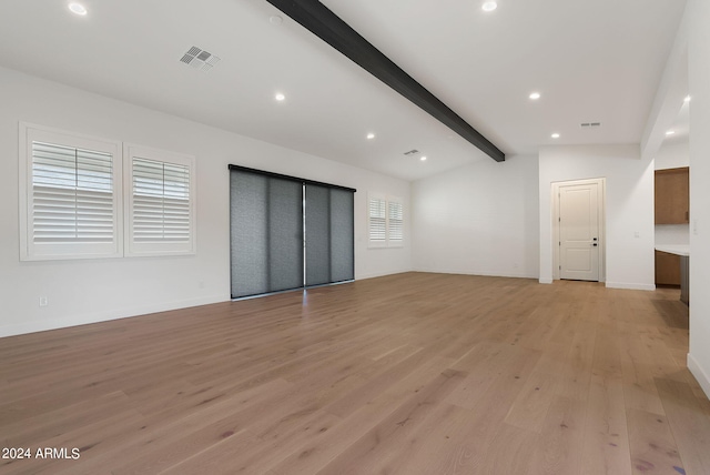 unfurnished living room featuring vaulted ceiling with beams, recessed lighting, visible vents, baseboards, and light wood finished floors