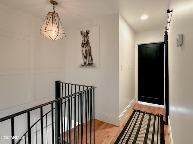 hall with hardwood / wood-style floors