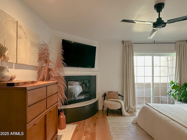 bedroom featuring light hardwood / wood-style flooring and ceiling fan