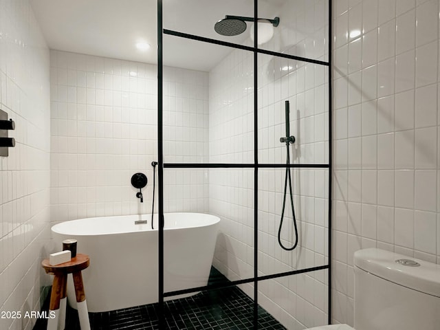 bathroom with tile walls, tile patterned floors, toilet, and separate shower and tub