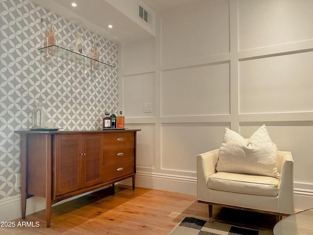 sitting room featuring light wood-type flooring