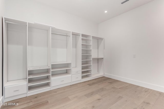 6970 E Joshua Tree Ln, Paradise Valley, AZ 85253 - spacious closet with light wood-type flooring