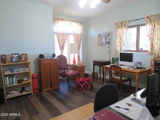 office space with dark wood-type flooring and baseboards