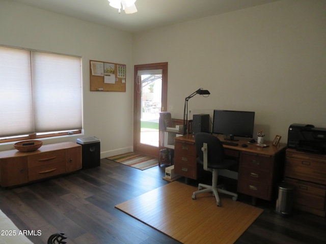 office with baseboards, dark wood finished floors, and a ceiling fan