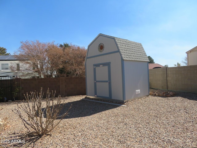 view of shed with a fenced backyard