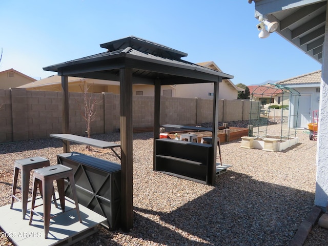 view of patio / terrace with a fenced backyard and a garden