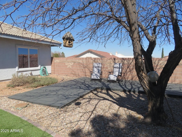 view of yard featuring a fenced backyard and a patio