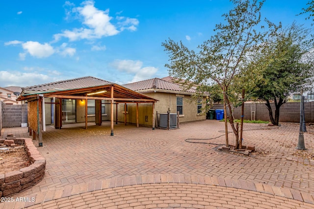 back of house with a patio area and central air condition unit