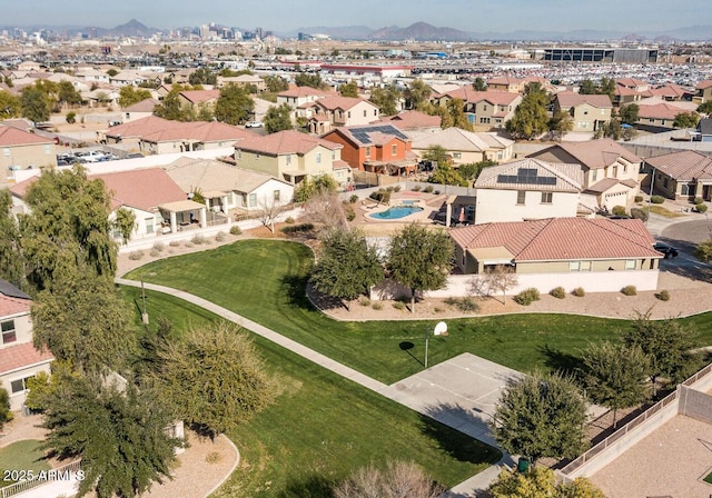 birds eye view of property with a mountain view