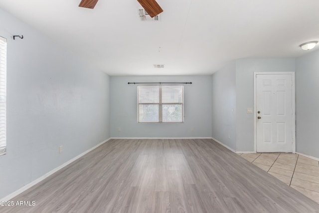 unfurnished room featuring ceiling fan and light hardwood / wood-style flooring