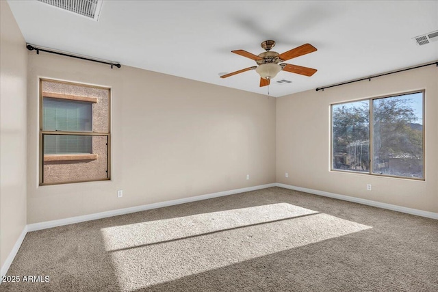 unfurnished room featuring carpet and ceiling fan