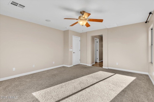 empty room featuring carpet and ceiling fan