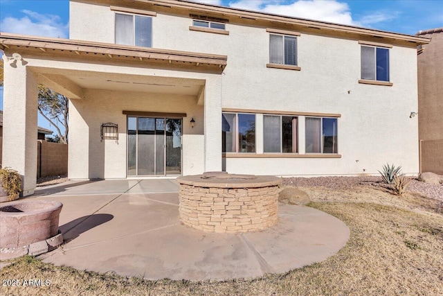 back of property featuring a patio area