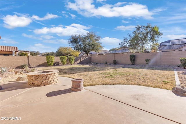 view of patio / terrace featuring an outdoor fire pit