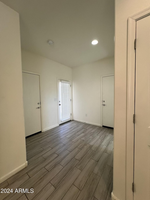 empty room featuring wood-type flooring