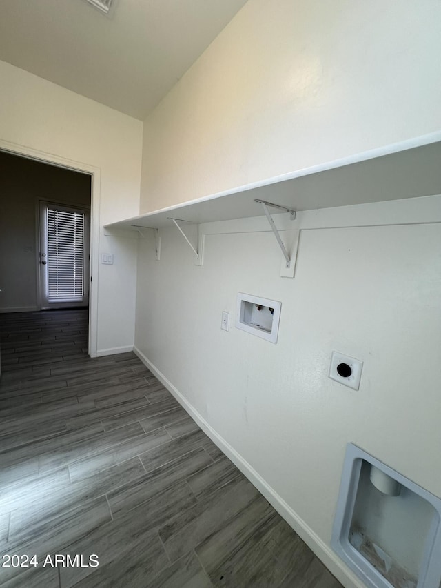 washroom featuring electric dryer hookup, dark hardwood / wood-style flooring, and hookup for a washing machine