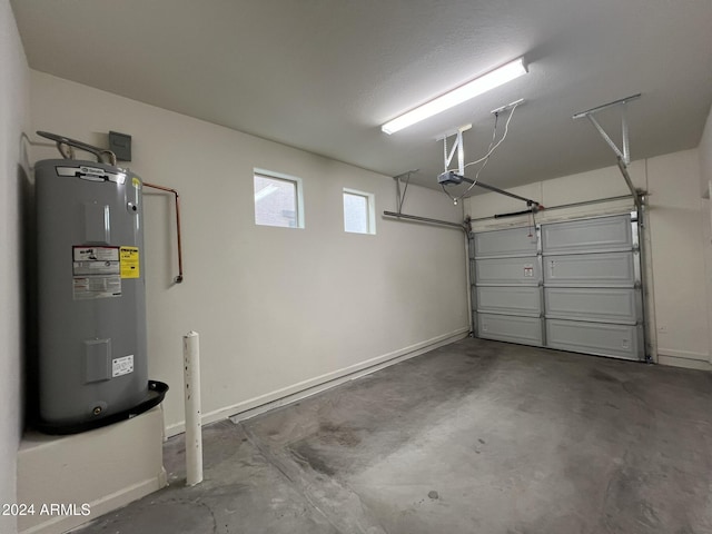 garage featuring electric water heater and a garage door opener