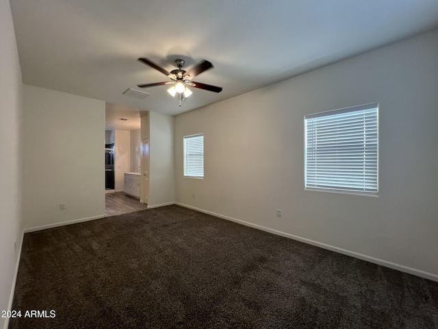 carpeted empty room with ceiling fan