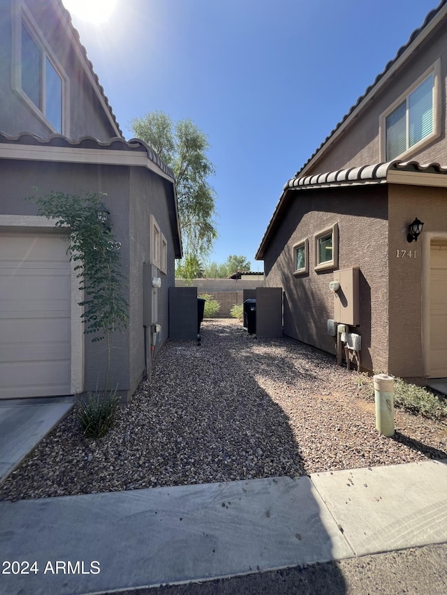 view of property exterior with a garage