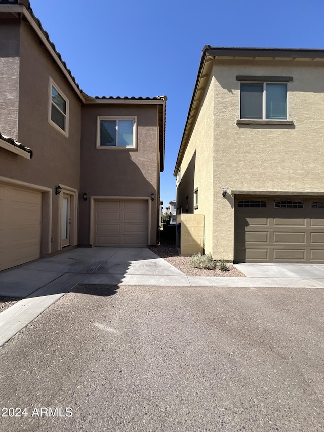 view of property exterior featuring a garage