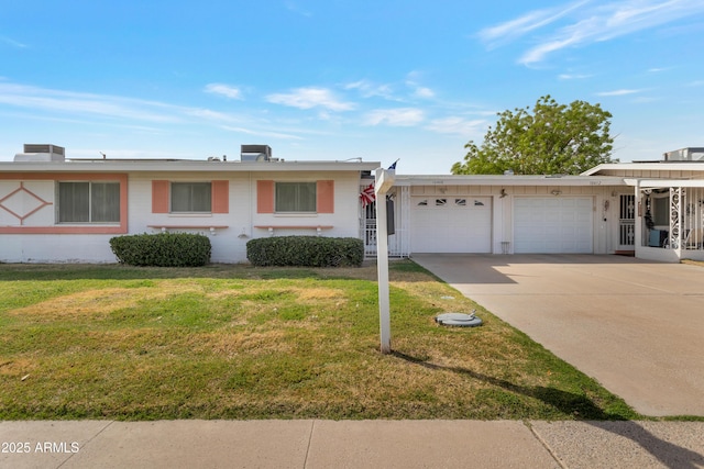 ranch-style house featuring a garage, concrete driveway, and a front lawn