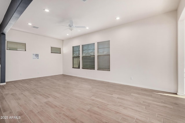 spare room with light wood finished floors, ceiling fan, visible vents, and recessed lighting