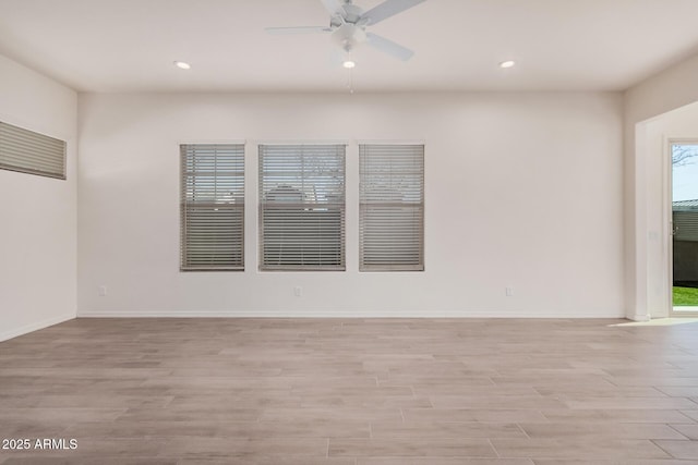 unfurnished room featuring light wood-style floors, ceiling fan, and recessed lighting