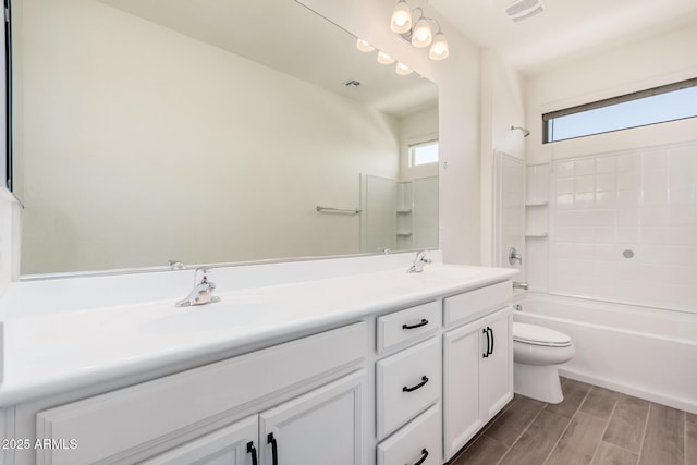 full bathroom with double vanity, visible vents, toilet, shower / bathtub combination, and a sink