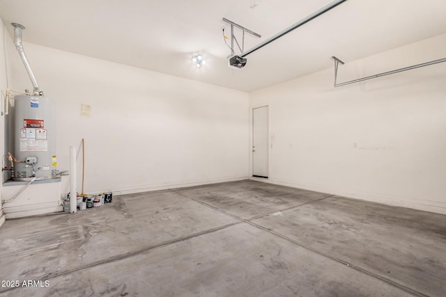 garage with water heater and a garage door opener