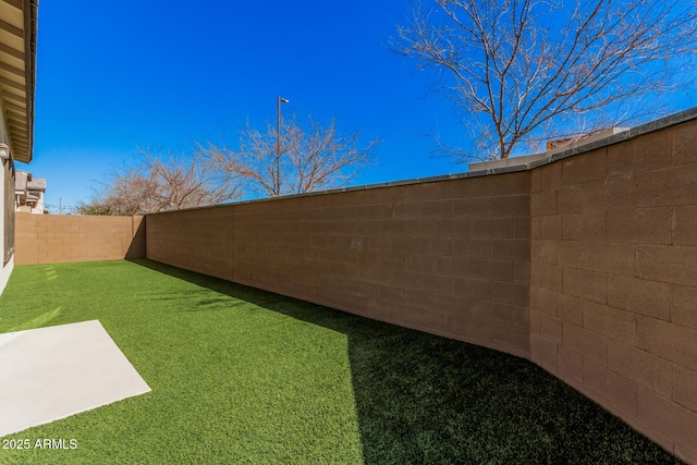 view of yard featuring a fenced backyard