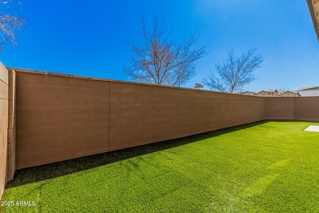 view of yard featuring a fenced backyard