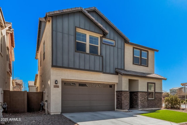 view of front of property featuring driveway, board and batten siding, an attached garage, and stucco siding