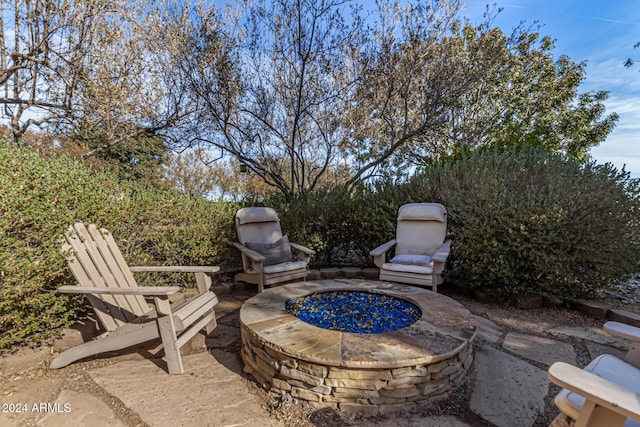 view of patio with an outdoor fire pit