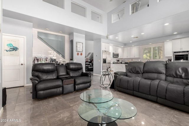 living room with a high ceiling