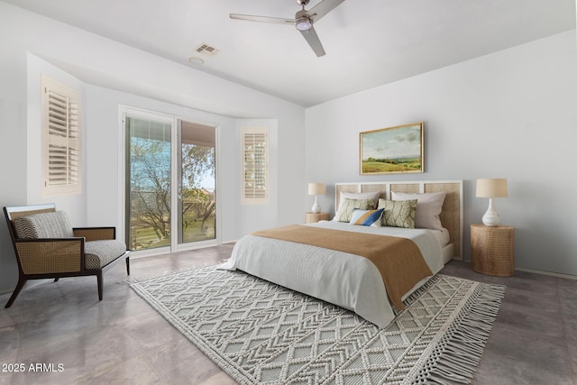 bedroom featuring ceiling fan, concrete flooring, and access to outside