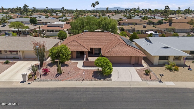 birds eye view of property featuring a residential view and a mountain view