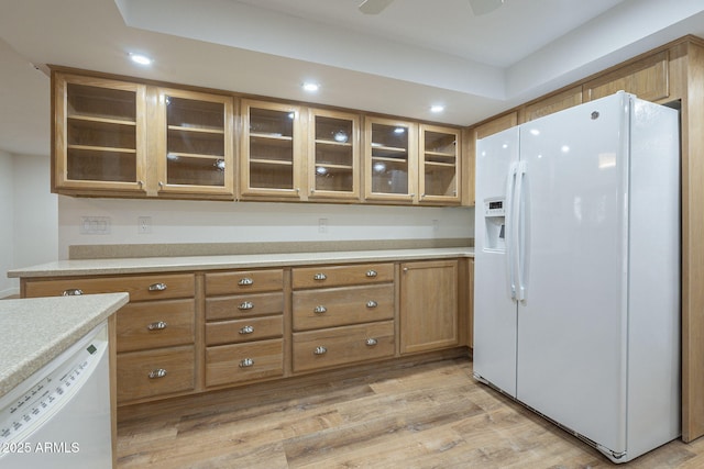 kitchen with white appliances, light hardwood / wood-style floors, and ceiling fan