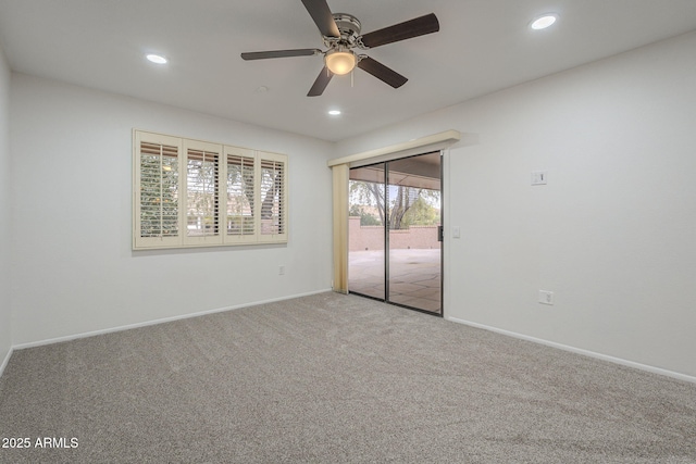 empty room with ceiling fan and carpet flooring