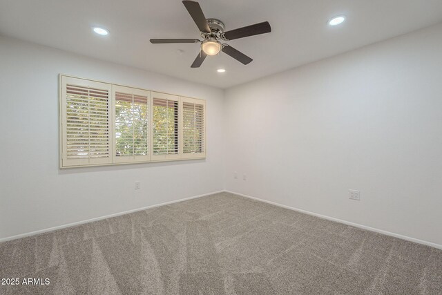 carpeted empty room with ceiling fan